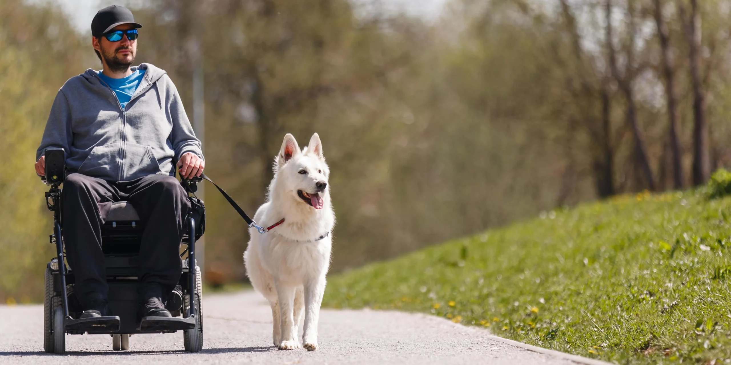 man using electric wheelchair hero